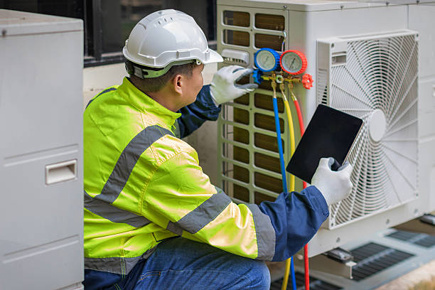 Professional Air Conditioning Repair technician working in Lakeville, MA